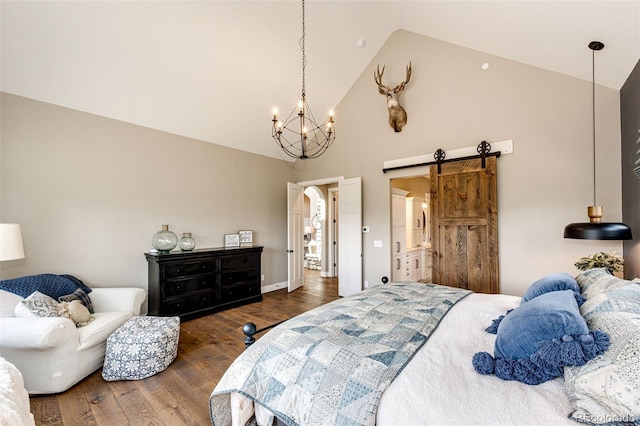 31455 Half Peak Trl, Pine, CO 80470 - bedroom with a barn door, high vaulted ceiling, wood finished floors, and a chandelier