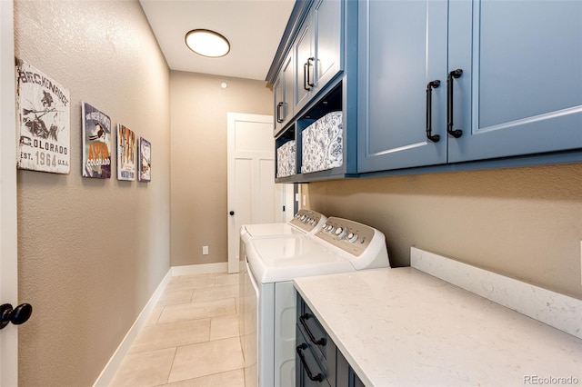 31455 Half Peak Trl, Pine, CO 80470 - laundry room featuring cabinet space, independent washer and dryer, baseboards, and light tile patterned floors