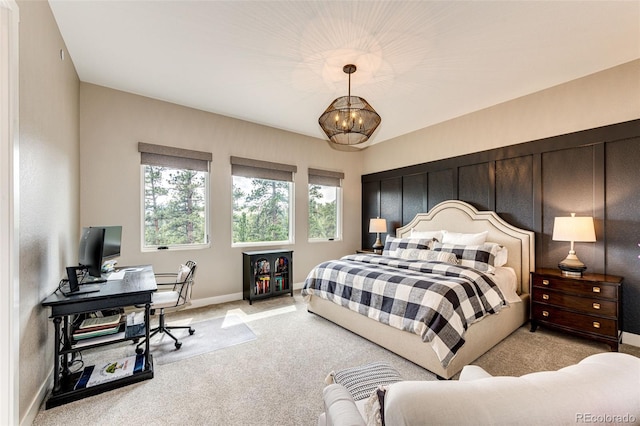 31455 Half Peak Trl, Pine, CO 80470 - bedroom featuring light carpet, baseboards, a desk, and a chandelier