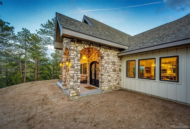 31455 Half Peak Trl, Pine, CO 80470 - entrance to property with roof with shingles, board and batten siding, and stone siding