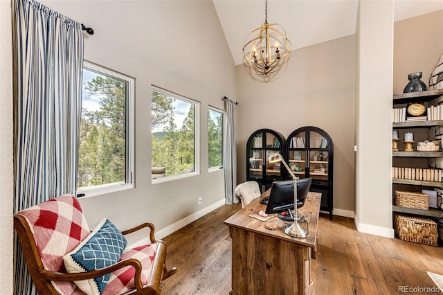 31455 Half Peak Trl, Pine, CO 80470 - office area featuring a chandelier, wood-type flooring, baseboards, and high vaulted ceiling