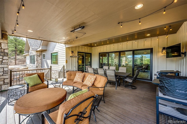 31455 Half Peak Trl, Pine, CO 80470 - wooden deck with outdoor dining space and an outdoor living space