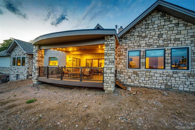 31455 Half Peak Trl, Pine, CO 80470 - rear view of house featuring stone siding