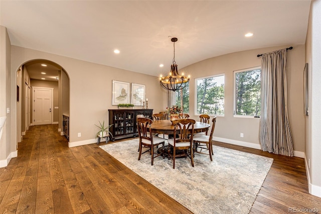 31455 Half Peak Trl, Pine, CO 80470 - dining space featuring arched walkways, dark wood-style floors, recessed lighting, baseboards, and a chandelier