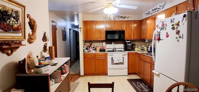 8338 Charles Way, Denver, CO 80221 - kitchen featuring white appliances, ceiling fan, brown cabinetry, and light floors