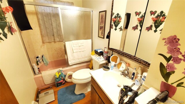 8338 Charles Way, Denver, CO 80221 - full bathroom with toilet, vanity, and combined bath / shower with glass door