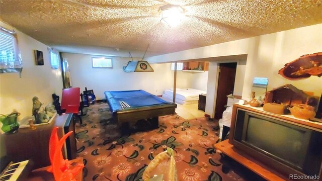 8338 Charles Way, Denver, CO 80221 - recreation room with billiards, a textured ceiling, and carpet