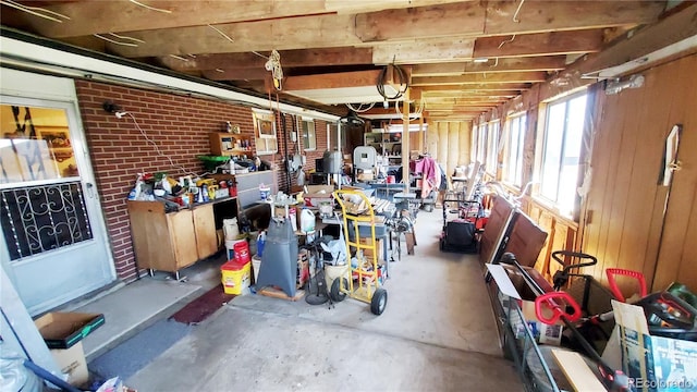 8338 Charles Way, Denver, CO 80221 - basement featuring a workshop area and brick wall