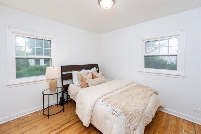 5680 W 41st Ave, Wheat Ridge, CO 80212 - bedroom with wood finished floors and baseboards