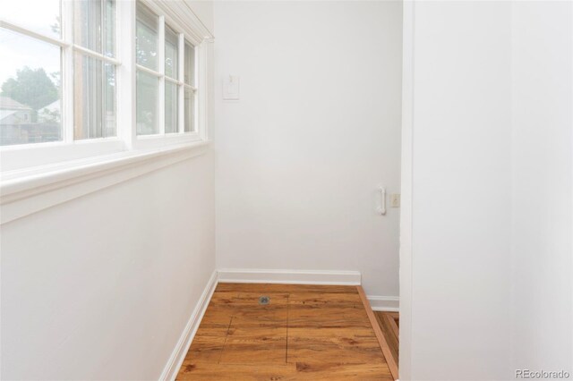 5680 W 41st Ave, Wheat Ridge, CO 80212 - hallway featuring wood finished floors and baseboards