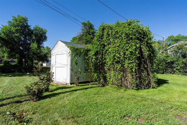 5680 W 41st Ave, Wheat Ridge, CO 80212 - view of grassy yard featuring a shed