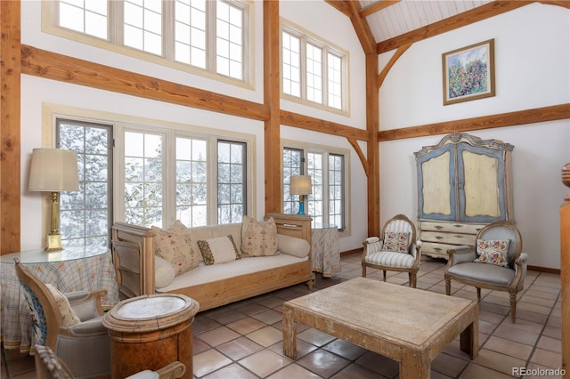 living room featuring high vaulted ceiling, beamed ceiling, and tile patterned floors