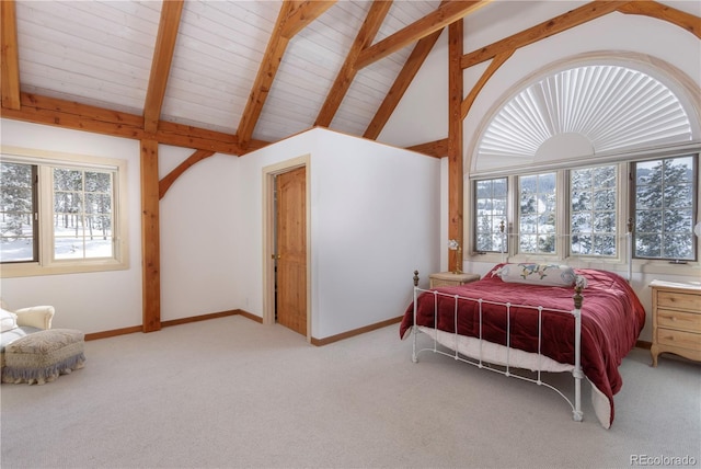 bedroom with carpet floors, beamed ceiling, high vaulted ceiling, and baseboards