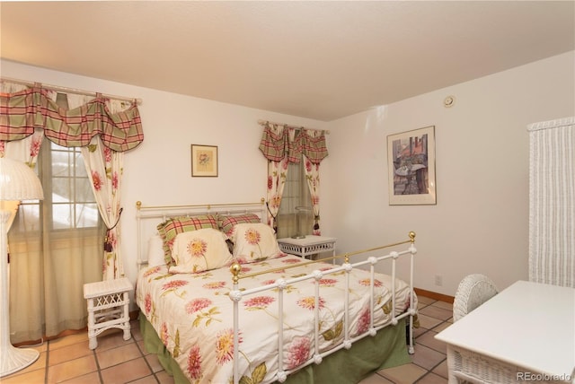 tiled bedroom with baseboards