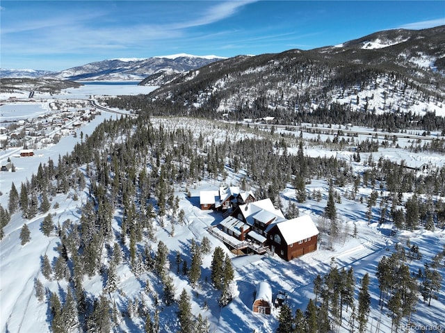 snowy aerial view with a mountain view