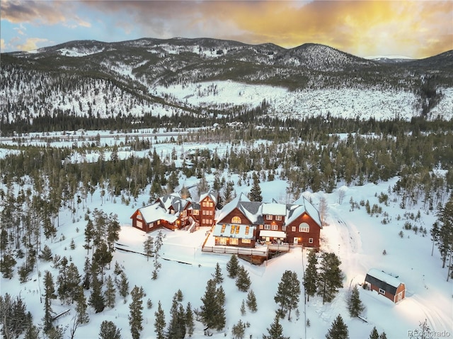 snowy aerial view with a mountain view