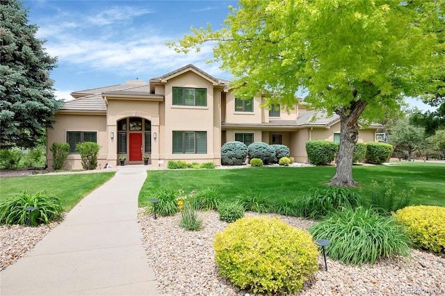 9669 E Prentice Cir, Greenwood Village, CO 80111 - view of front of house featuring stucco siding, a front lawn, and a tiled roof