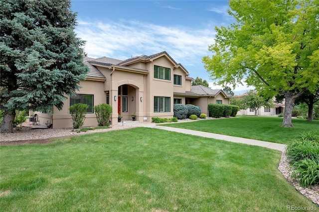 9669 E Prentice Cir, Greenwood Village, CO 80111 - view of front of property with a front yard, stucco siding, and a tile roof