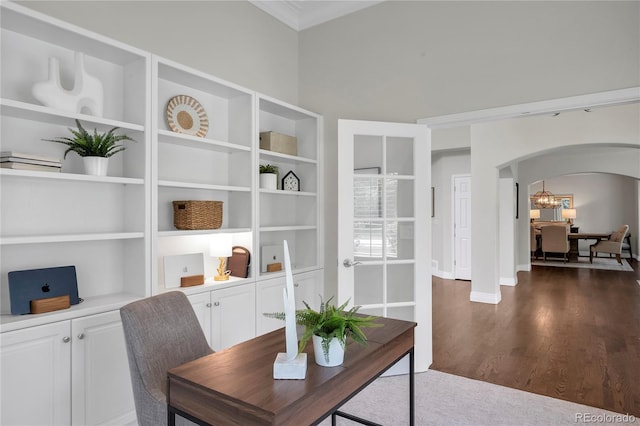 9669 E Prentice Cir, Greenwood Village, CO 80111 - office area featuring arched walkways, dark wood-style floors, crown molding, a chandelier, and built in shelves