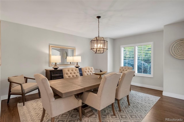 9669 E Prentice Cir, Greenwood Village, CO 80111 - dining area featuring baseboards, a chandelier, and wood finished floors