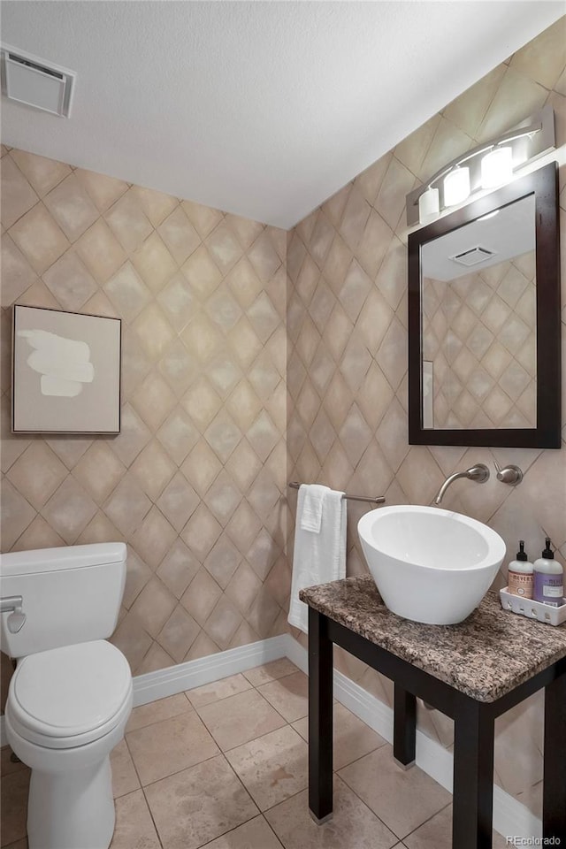 9669 E Prentice Cir, Greenwood Village, CO 80111 - half bathroom with a sink, toilet, and baseboards