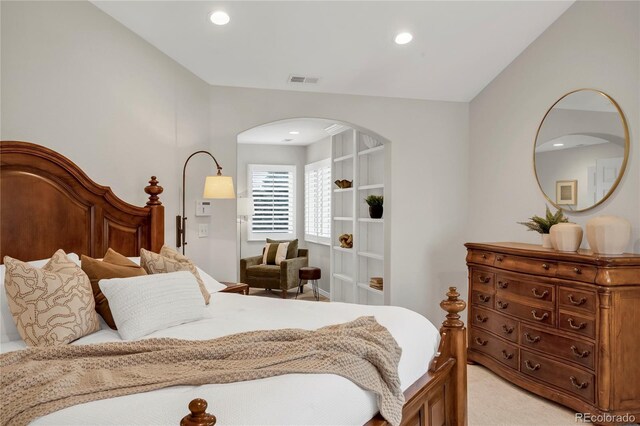 9669 E Prentice Cir, Greenwood Village, CO 80111 - bedroom with arched walkways, light carpet, and recessed lighting