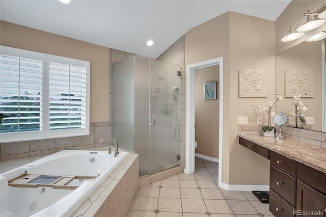 9669 E Prentice Cir, Greenwood Village, CO 80111 - full bathroom with vanity, a stall shower, a garden tub, tile patterned flooring, and toilet
