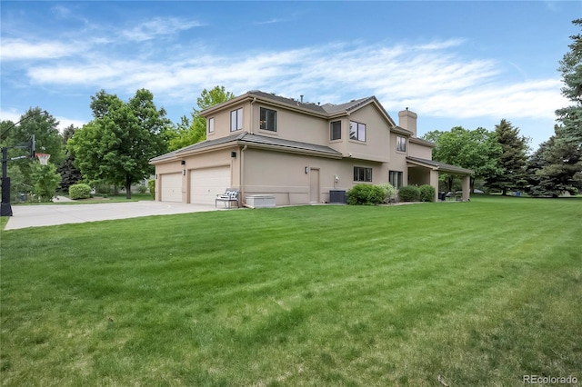 9669 E Prentice Cir, Greenwood Village, CO 80111 - traditional-style home featuring a chimney, stucco siding, a front lawn, a garage, and driveway