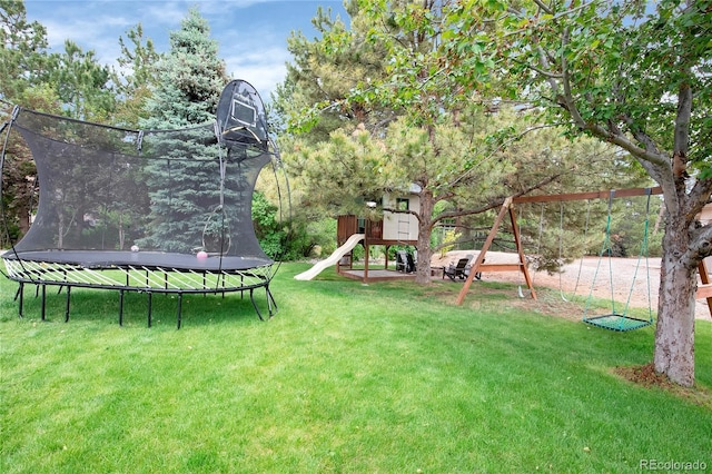 9669 E Prentice Cir, Greenwood Village, CO 80111 - view of green lawn featuring a trampoline and a playground