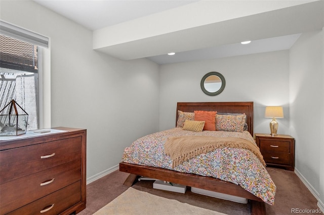 bedroom with carpet floors and baseboards