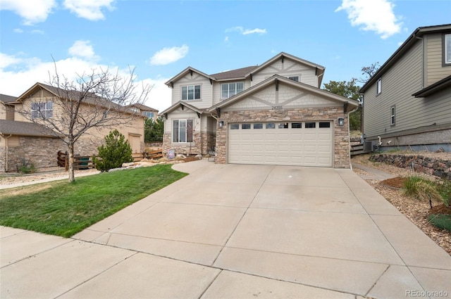 view of front of home with driveway, central AC unit, a garage, a front lawn, and stone siding