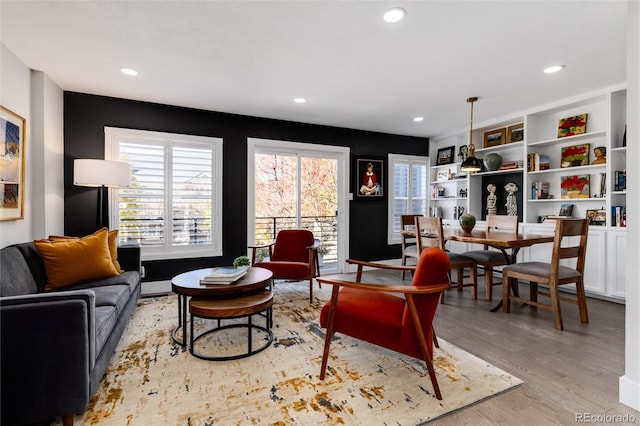 living room with light hardwood / wood-style flooring