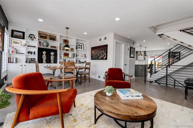 living room with light wood-type flooring and plenty of natural light