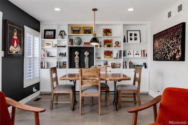 dining space featuring hardwood / wood-style floors