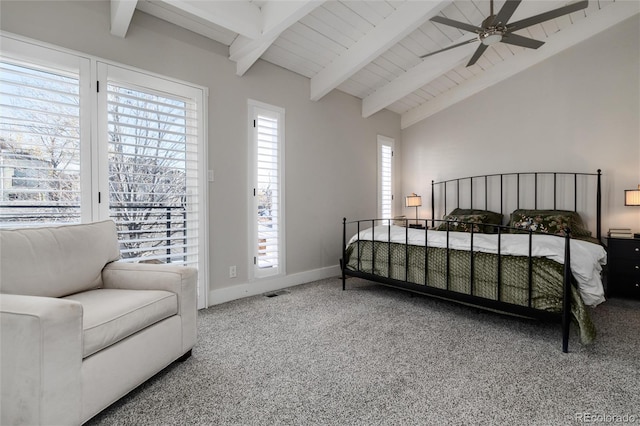 carpeted bedroom with ceiling fan, lofted ceiling with beams, and wood ceiling