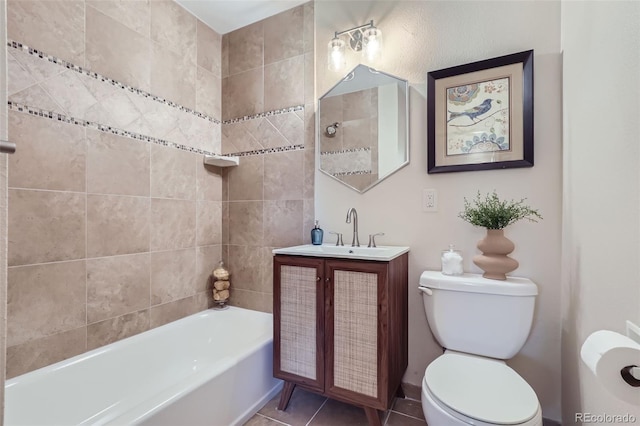 bathroom featuring vanity, toilet, and tile patterned flooring