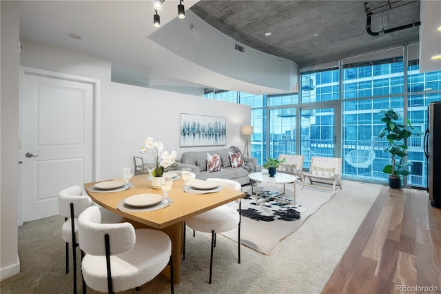 1700 Bassett St Unit 1119, Denver, CO 80202 - carpeted dining space with a wall of windows