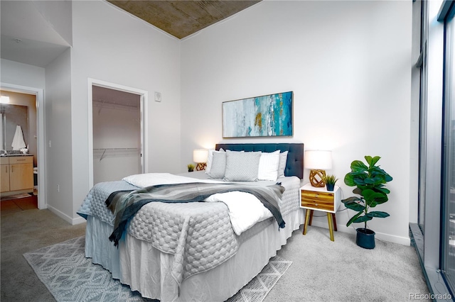 1700 Bassett St Unit 1119, Denver, CO 80202 - carpeted bedroom featuring a closet, baseboards, and a spacious closet