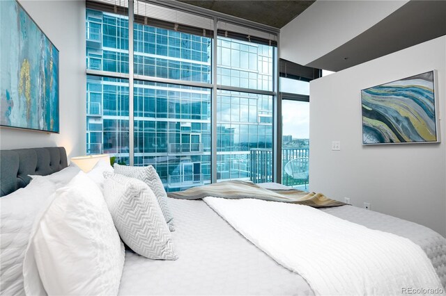 1700 Bassett St Unit 1119, Denver, CO 80202 - bedroom featuring expansive windows, access to exterior, and multiple windows
