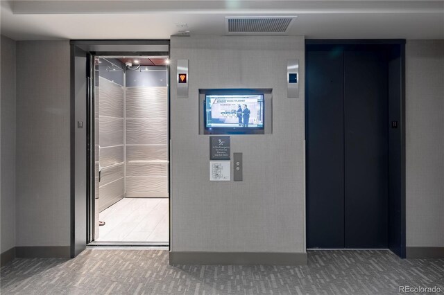 1700 Bassett St Unit 1119, Denver, CO 80202 - bathroom featuring elevator and baseboards
