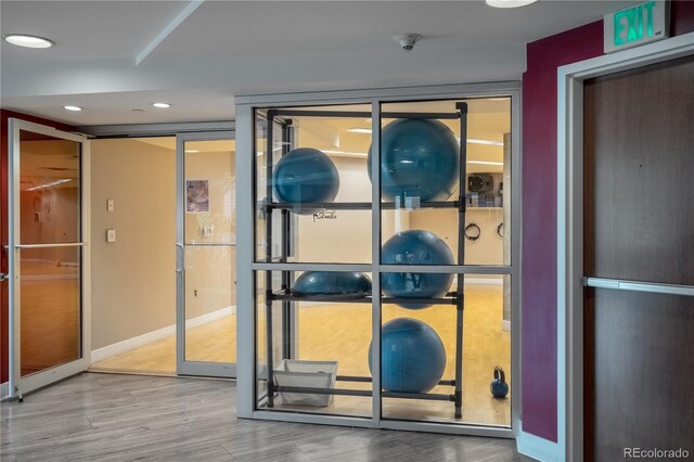 1700 Bassett St Unit 1119, Denver, CO 80202 - detailed view of wood finished floors, a smoke detector, recessed lighting, and baseboards