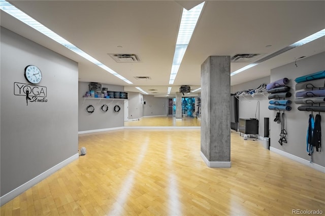 1700 Bassett St Unit 1119, Denver, CO 80202 - exercise room with baseboards and wood finished floors