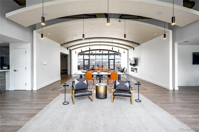 1700 Bassett St Unit 1119, Denver, CO 80202 - dining room with wood finished floors, baseboards, and vaulted ceiling