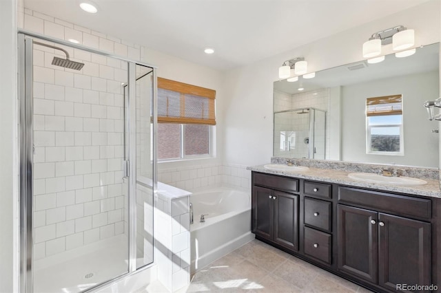 6214 Long Branch Dr, Parker, CO 80134 - bathroom featuring a sink, double vanity, a stall shower, and a garden tub