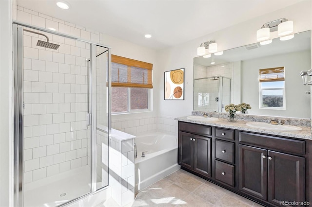 6214 Long Branch Dr, Parker, CO 80134 - full bathroom featuring a sink, double vanity, a garden tub, and a shower stall