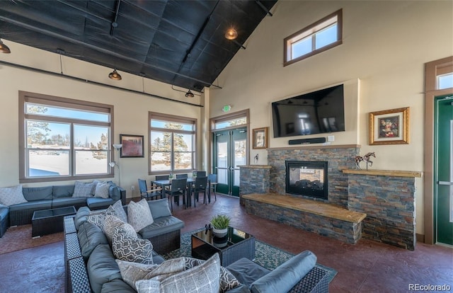 6214 Long Branch Dr, Parker, CO 80134 - living room featuring carpet flooring, french doors, high vaulted ceiling, a fireplace, and beamed ceiling