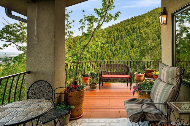 8932 Eastridge Rd, Golden, CO 80403 - deck featuring a forest view