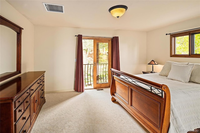 8932 Eastridge Rd, Golden, CO 80403 - bedroom with access to outside, light carpet, and baseboards
