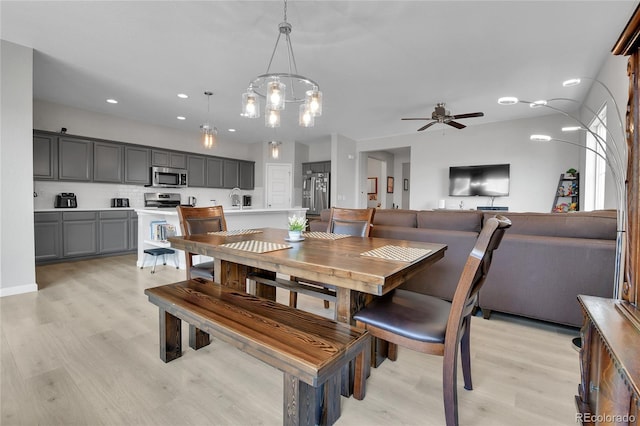 27853 E 8th Ave, Aurora, CO 80018 - dining room with light wood finished floors, ceiling fan, and recessed lighting