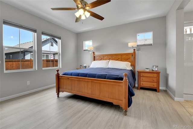 27853 E 8th Ave, Aurora, CO 80018 - bedroom with light wood finished floors and ceiling fan
